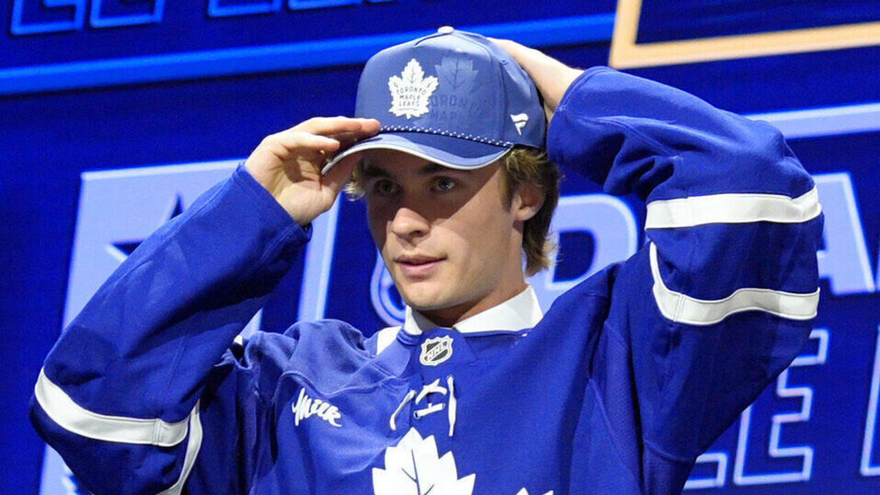 BUFFALO, NEW YORK - JUNE 26: Gavin McKenna puts on a Toronto Maple Leafs hat after being selected first overall by the Leafs during Day One of the 2026 NHL Draft at KeyBank Center on June 26, 2026 in Buffalo, New York.