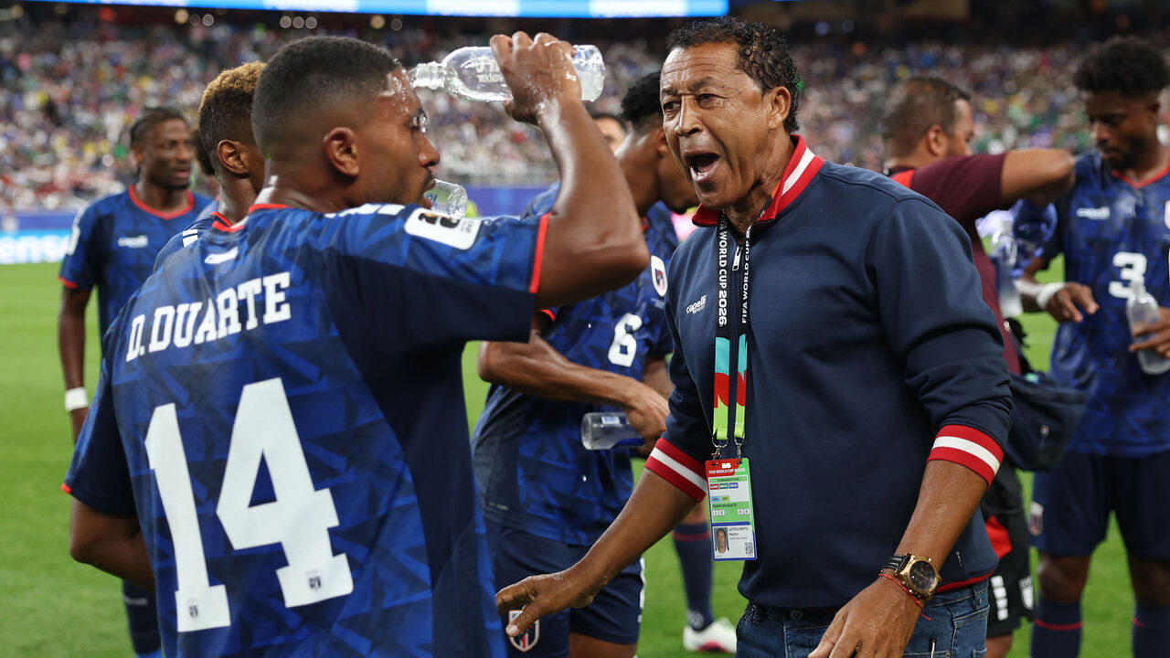 HOUSTON, TEXAS - JUNE 26: Bubista, Head Coach of Cabo Verde, speaks with Deroy Duarte #14 and teammates during the FIFA World Cup 2026 Group H match between Cabo Verde and Saudi Arabia at Houston Stadium on June 26, 2026 in Houston, Texas.