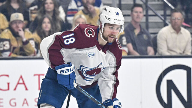 LAS VEGAS , NV - MAY 24: Jack Drury (18) of the Colorado Avalanche passes as Brayden McNabb (3) of the Vegas Golden Knights goes to his knees during the first period of Game 3 of the NHL Western Conference Final at T-Mobile Arena in Las Vegas, Nevada on Sunday, May 24, 2026.