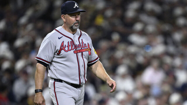 SAN DIEGO, CALIFORNIA - JUNE 22: Manager Walt Weiss #22 of the Atlanta Braves walks to the mound during a pitching change in the seventh inning against the San Diego Padres at Petco Park on June 22, 2026 in San Diego, California.