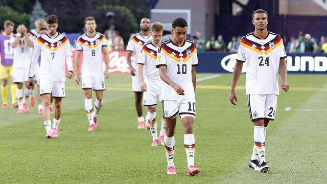 FOXBOROUGH, MASSACHUSETTS - JUNE 29: Jamal Musiala #10, Malick Thiaw #24 of Germany and teammates dejected after their defeat in the FIFA World Cup 2026 Round Of 32 football match between Germany and Paraguay at Boston Stadium on June 29, 2026 in Foxborough, Massachusetts.