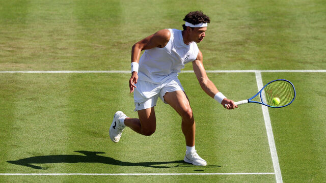 LONDON, ENGLAND - JUNE 30: Ben Shelton of United States plays a forehand against Otto Virtanen of Finland during their Gentlemen's Singles first round match on day two of The Championships Wimbledon 2026 at All England Lawn Tennis and Croquet Club on June 30, 2026 in London, England.
