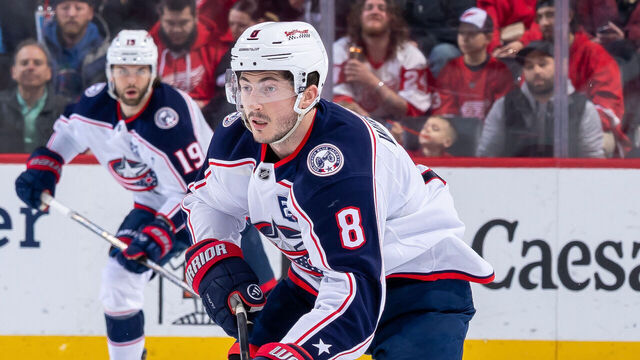 DETROIT, MICHIGAN - APRIL 07: Zach Werenski #8 of the Columbus Blue Jackets skates up ice with the puck against the Detroit Red Wings during the second period at Little Caesars Arena on April 7, 2026 in Detroit, Michigan.