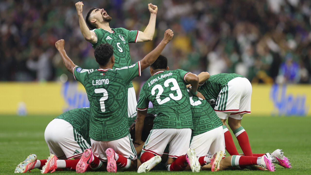 MEXICO CITY, MEXICO - JUNE 30: Raul Jimenez #9 of Mexico (obscured) celebrates scoring his team's second goal with Johan Vasquez #5 and team mates during the FIFA World Cup 2026 Round Of 32 match between Mexico and Ecuador at Mexico City Stadium on June 30, 2026 in Mexico City, Mexico.