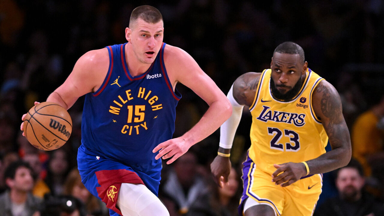 Los Angeles, CA - April 25:Nuggets Nikola Jokic, #15, drives downcourt followed by Lakers LeBron James, #23, during second quarter action in game 3 of the first-round playoff series at Crypto.com Arena on Thursday, April 25, 2024.