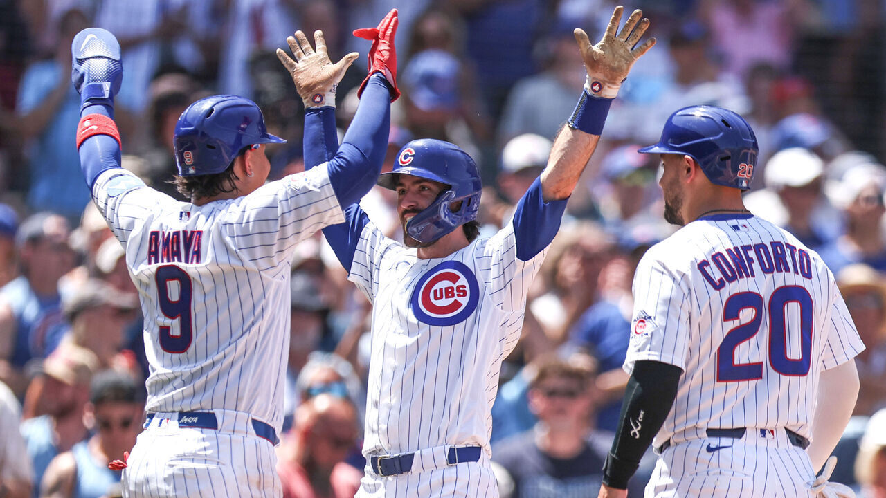 CHICAGO, ILLINOIS - JULY 1: Dansby Swanson #7 of the Chicago Cubs celebrates hitting a three-run home run with teammates Miguel Amaya #9 and Michael Conforto #20 during the third inning against the San Diego Padres at Wrigley Field on July 1, 2026 in Chicago, Illinois.