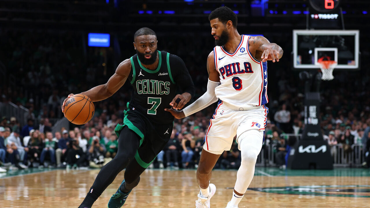 BOSTON, MASSACHUSETTS - APRIL 28: Jaylen Brown #7 of the Boston Celtics drives to the basket against Paul George #8 of the Philadelphia 76ers during the fourth quarter in Game Five of the First Round of the NBA Eastern Conference Playoff at TD Garden on April 28, 2026 in Boston, Massachusetts.