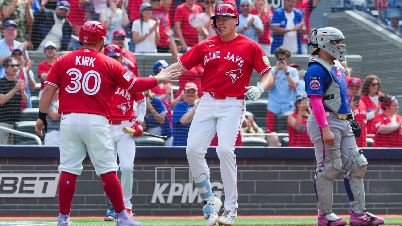 TORONTO, CANADA - JULY 01: Sean Keys #20 of the Toronto Blue Jays celebrates his three run home run with Alejandro Kirk #30 in the third inning against the New York Mets at Rogers Centre on July 01, 2026 in Toronto, Ontario, Canada.