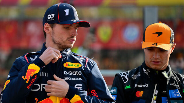 McLaren's British driver Lando Norris and Red Bull Racing's Dutch driver Max Verstappen stand on the grid ahead of the Abu Dhabi Formula One Grand Prix at the Yas Marina Circuit in Abu Dhabi on December 7, 2025.