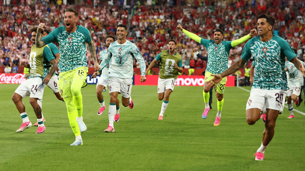 Portugal's forward #07 Cristiano Ronaldo celebrates with teammates after his team scored their second goal during the 2026 World Cup round of 32 football match between Portugal and Croatia at the Toronto Stadium in Toronto on July 2, 2026.