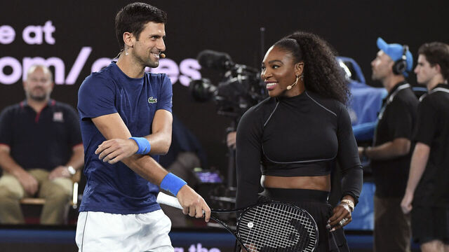 Serena Williams of the US and Novak Djokovic of Serbia share a lighter moment as they and other top players play in the Rally for Relief charity tennis match in support of the victims of the Australian bushfires, in Melbourne of January 15, 2020, ahead of the Australian Open tennis tournament. / -- IMAGE RESTRICTED TO EDITORIAL USE - STRICTLY NO COMMERCIAL USE --