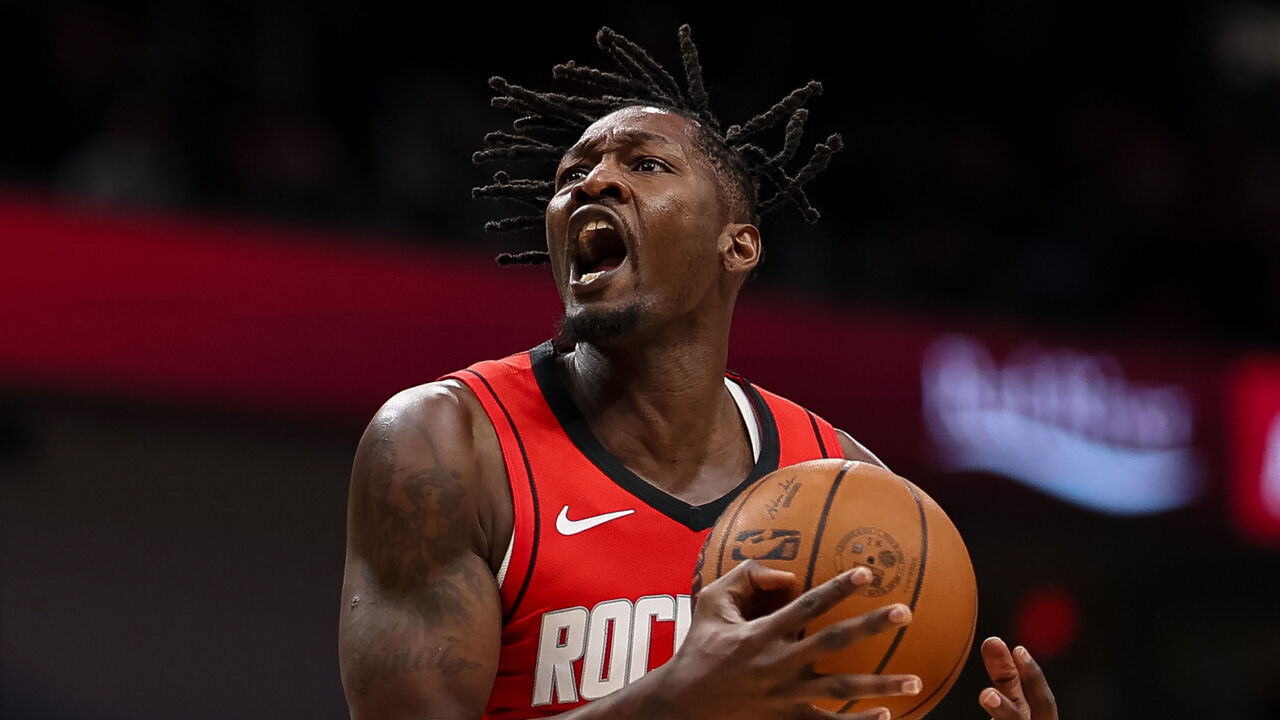 WASHINGTON, DC - MARCH 02: Dorian Finney-Smith #2 of the Houston Rockets goes to the basket against Julian Reese #15 of the Washington Wizards during the first half at Capital One Arena on March 2, 2026 in Washington, DC.