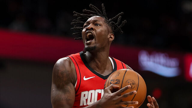 WASHINGTON, DC - MARCH 02: Dorian Finney-Smith #2 of the Houston Rockets goes to the basket against Julian Reese #15 of the Washington Wizards during the first half at Capital One Arena on March 2, 2026 in Washington, DC.