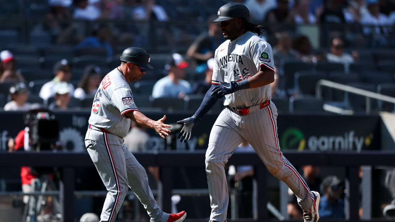 NEW YORK, NEW YORK - JULY 04: Josh Bell #56 of the Minnesota Twins celebrates with Ramon Borrego #46 after hitting a home run during the eighth inning at Yankee Stadium on July 04, 2026 in New York City.