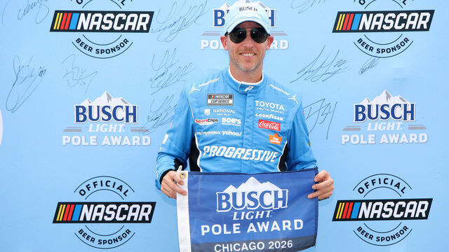 JOLIET, ILLINOIS - JULY 04: Denny Hamlin, driver of the #11 Progressive Insurance Toyota, poses for photos after winning the pole award during qualifying for the NASCAR Cup Series eero 400 at Chicagoland Speedway on July 04, 2026 in Joliet, Illinois.