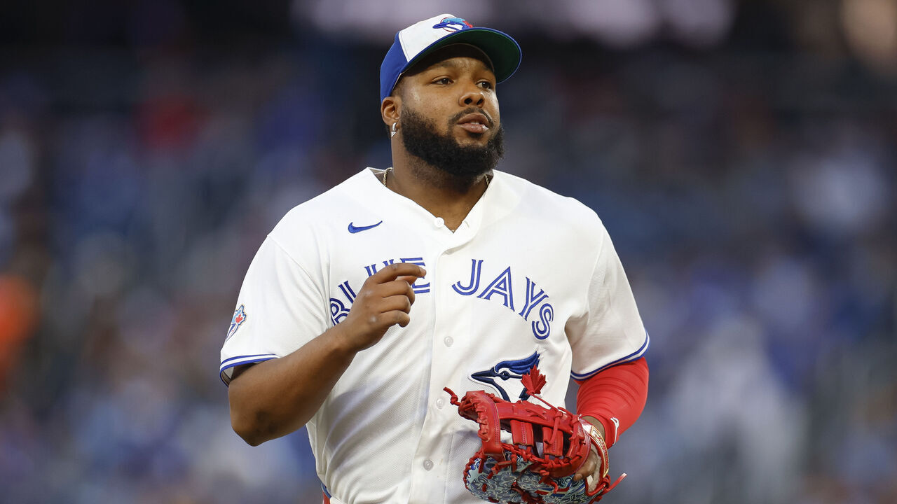 TORONTO, CANADA - JUNE 25: Vladimir Guerrero Jr. #27 of the Toronto Blue Jays jogs to the dugout in the fifth inning during a game against the Texas Rangers at Rogers Centre on June 25, 2026 in Toronto, Canada.