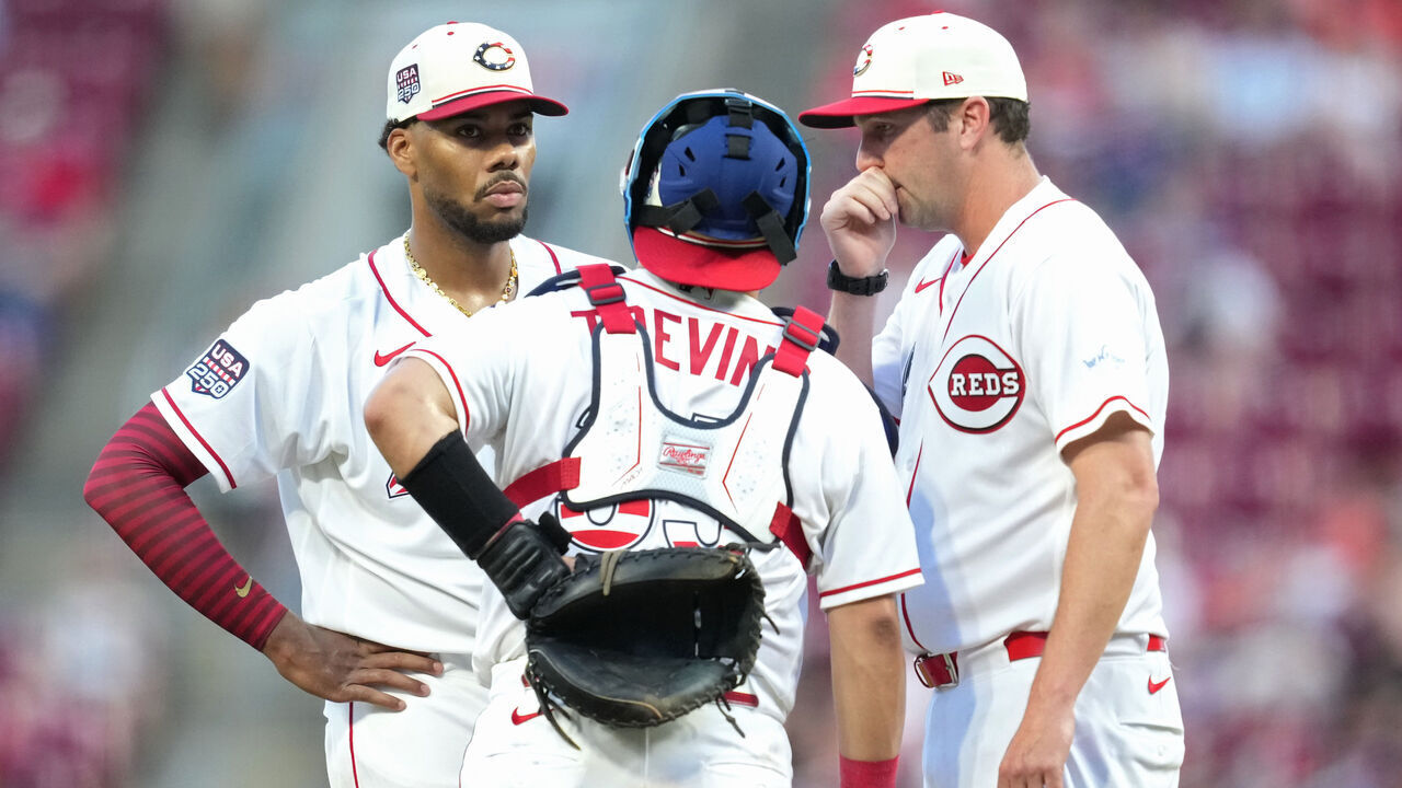 CINCINNATI, OHIO - JULY 04: Pitcher Hunter Greene #21 of the Cincinnati Reds speaks with catcher Jose Trevino #35 at the pitcher's mound during the fourth inning of a baseball game against the Baltimore Orioles at Great American Ball Park on July 04, 2026 in Cincinnati, Ohio.