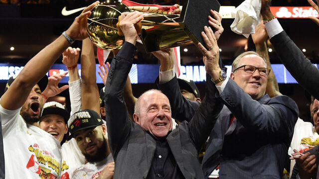 OAKLAND, CA - JUNE 13: Toronto Raptors team co owners Larry Tanenbaum and George Cope (R) victorious, holding up Larry O'Brien Championship Trophy after winning game vs Golden State Warriors during Game Six of the NBA Finals on June 13, 2019 at ORACLE Arena in Oakland, California. NOTE TO USER: User expressly acknowledges and agrees that, by downloading and/or using this photograph, user is consenting to the terms and conditions of Getty Images License Agreement. Mandatory Copyright Notice: Copyright 2019 NBAE