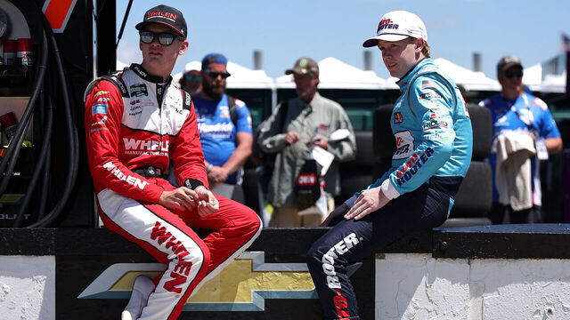 LONG POND, PENNSYLVANIA - JUNE 13: Jesse Love, driver of the #2 Whelen Chevrolet, (L) and Connor Zilisch, driver of the #1 Roto-Rooter Chevrolet, wait on the grid during qualifying for the NASCAR O'Reilly Auto Parts Series MillerTech Battery 250 presented by KOA at Pocono Raceway on June 13, 2026 in Long Pond, Pennsylvania.