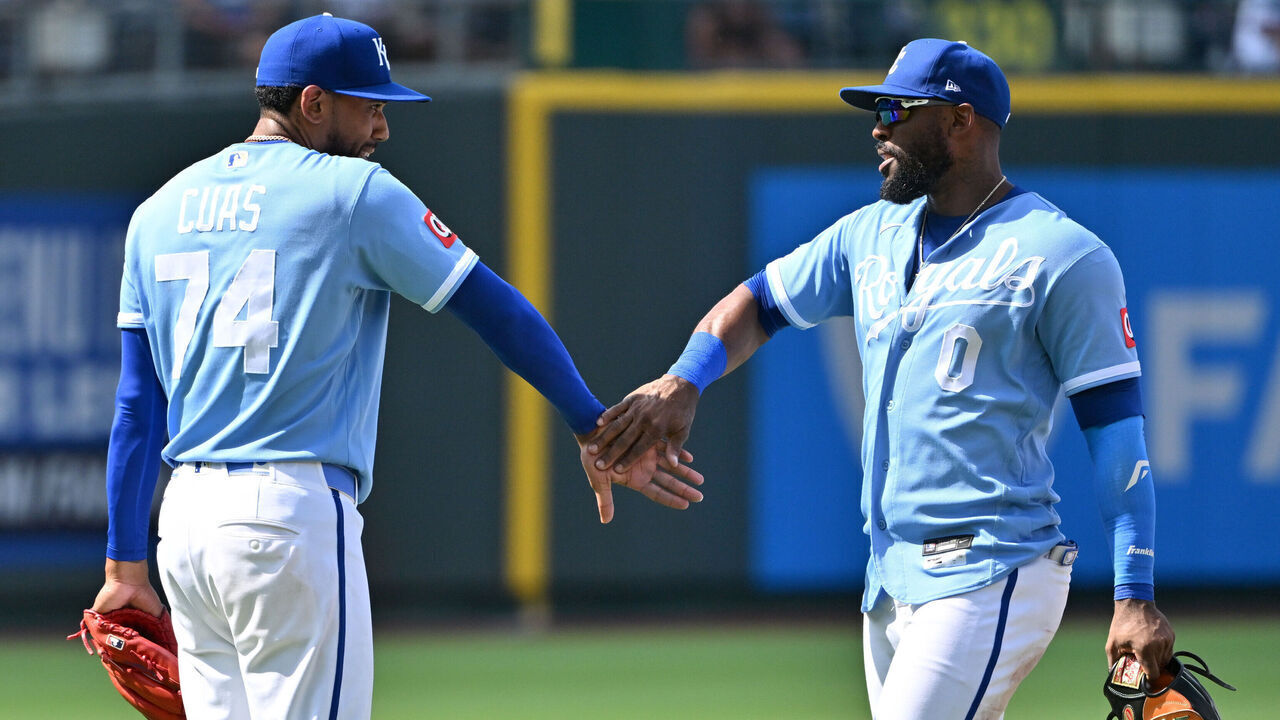 KANSAS CITY, MISSOURI - JULY 06: Jose Cuas #74 of the Kansas City Royals high fives Starling Marte #0 of the Kansas City Royals after defeating the Philadelphia Phillies at Kauffman Stadium on July 06, 2026 in Kansas City, Missouri.