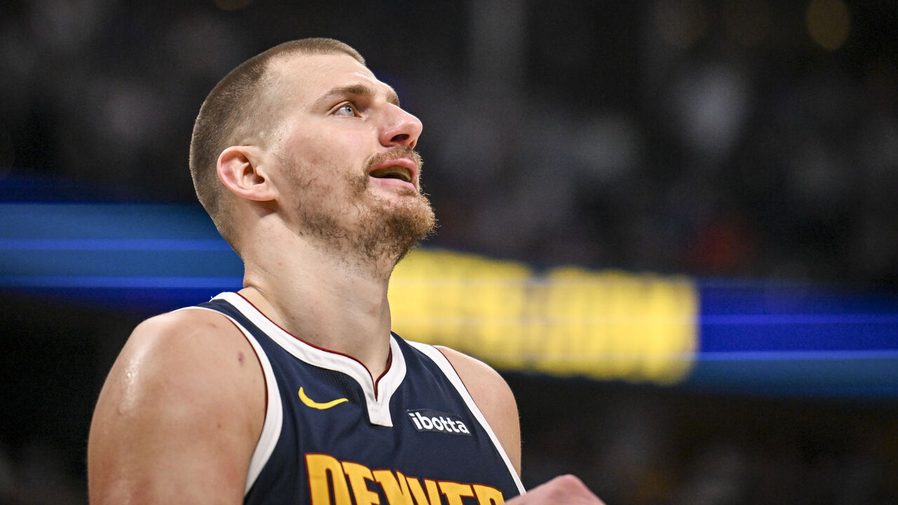 DENVER , CO - MARCH 25: Nikola Jokic (15) of the Denver Nuggets smiles after being called for a foul during the third quarter against the Dallas Mavericks at Ball Arena in Denver, Colorado on Wednesday, March 25, 2026.