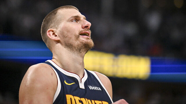 DENVER , CO - MARCH 25: Nikola Jokic (15) of the Denver Nuggets smiles after being called for a foul during the third quarter against the Dallas Mavericks at Ball Arena in Denver, Colorado on Wednesday, March 25, 2026.