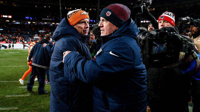 DENVER, COLORADO - DECEMBER 24: Head coach Sean Payton of the Denver Broncos greets head coach Bill Belichick of the New England Patriots after the game at Empower Field at Mile High on December 24, 2023 in Denver, Colorado.