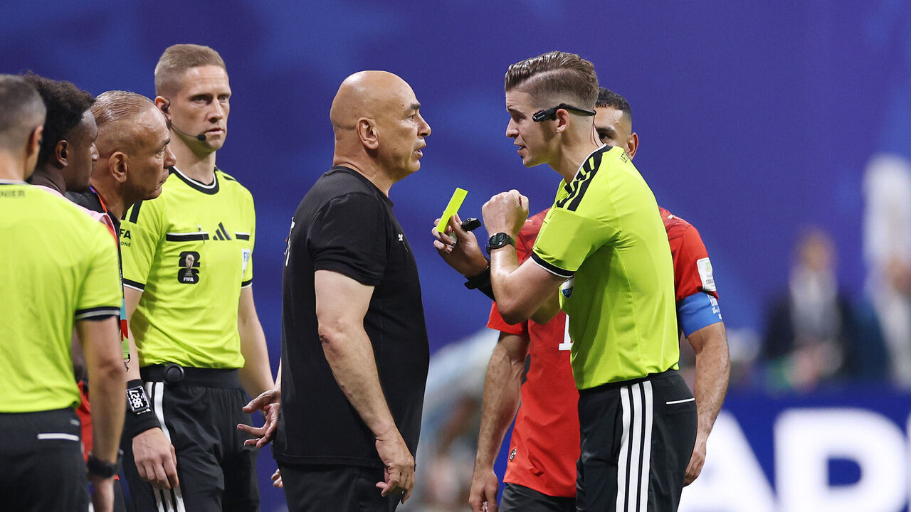 ATLANTA, GEORGIA - JULY 07: Referee Francois Letexier shows a yellow card to Hossam Hassan, Head Coach of Egypt, during the FIFA World Cup 2026 Round of 16 match between Argentina and Egypt at Atlanta Stadium on July 07, 2026 in Atlanta, Georgia.