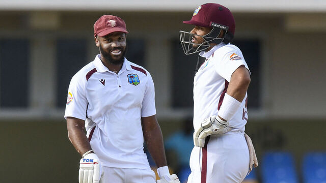 John Campbell (L) and Brandon King (R) of West Indies celebrate their 100 runs partnership during the fifth day of the second and final cricket Test match between Sri Lanka and West Indies at the Sir Vivian Richards Stadium in North Sound, Antigua and Barbuda, on July 7, 2026.