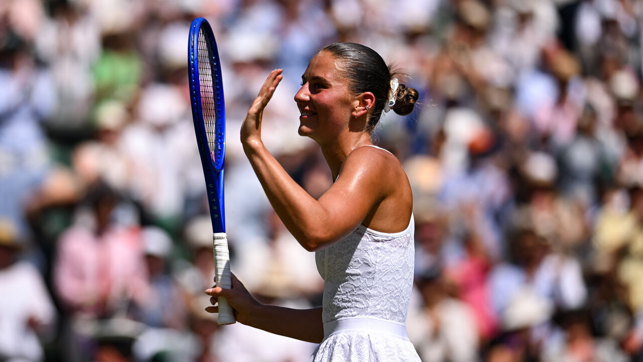 LONDON, ENGLAND - JULY 08: Marta Kostyuk of Ukraine celebrates winning match point against Jasmine Paolini of Italy during the Ladies' Singles Quarterfinal on Day Ten of The Championships Wimbledon 2026 at All England Lawn Tennis and Croquet Club on July 08, 2026 in London, England.