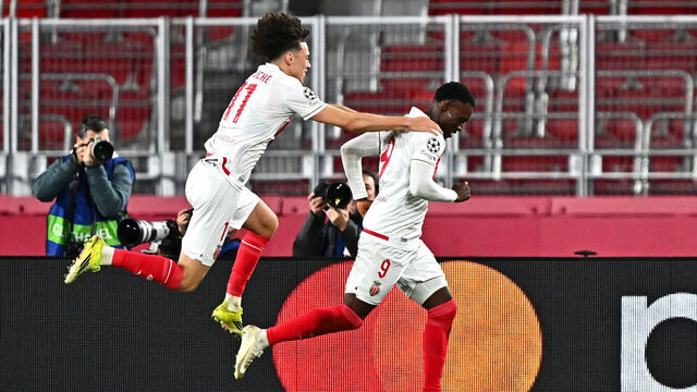 MONACO, MONACO - FEBRUARY 17: Folarin Balogun of AS Monaco celebrates scoring his team's second goal with teammate Maghnes Akliouche during the UEFA Champions League 2025/26 League Knockout Play-off First Leg match between AS Monaco and Paris Saint-Germain at Stade Louis II on February 17, 2026 in Monaco, Monaco.