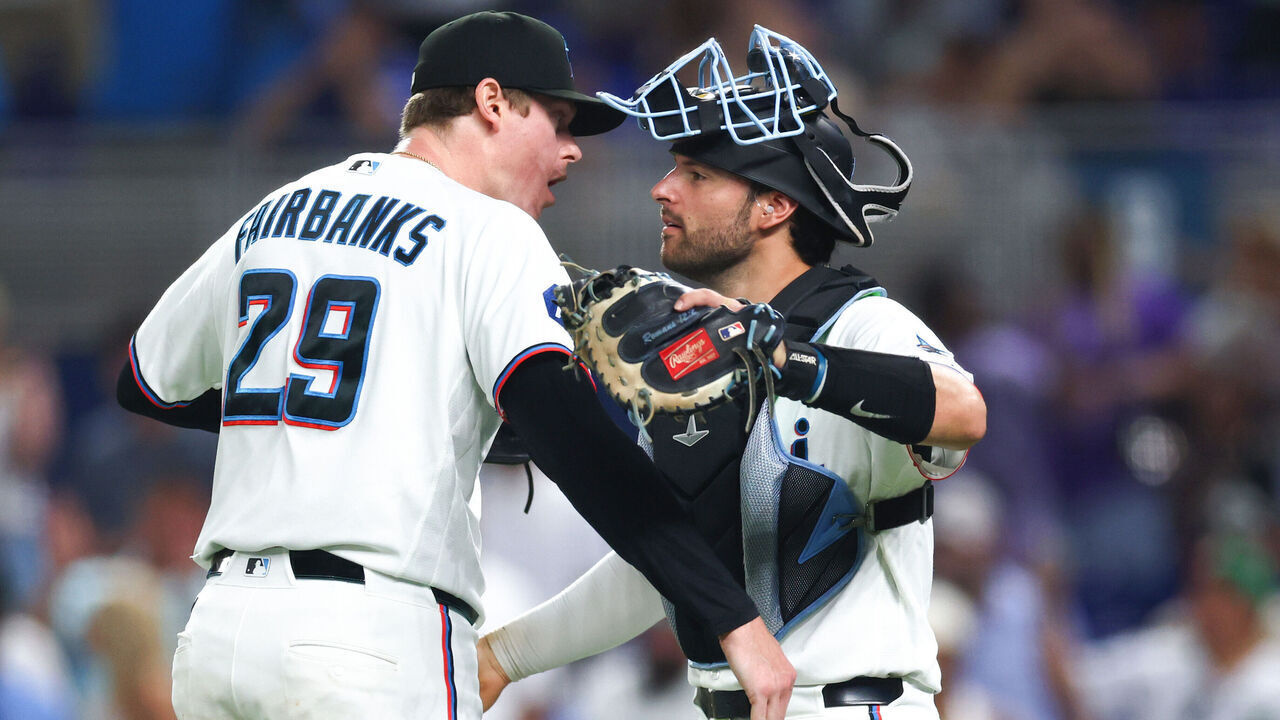 MIAMI, FLORIDA - JULY 08: Pete Fairbanks #29 and Joe Mack #80 of the Miami Marlins embrace after defeating the Seattle Mariners at loanDepot park on July 08, 2026 in Miami, Florida.