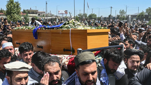 Afghanistan's cricketer Mohammad Nabi (C) and others carry the coffin of former international cricket player Shapoor Zadran before the funeral ceremony at the Eidgah Mosque in Kabul on July 9, 2026. Thousands of fans attended a Kabul funeral on July 9 for Afghan fast bowler Shapoor Zadran, who helped shape the country's early rise in international cricket.