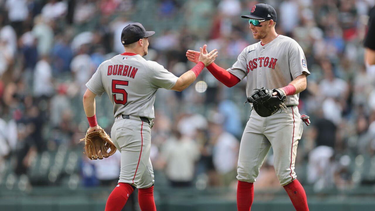 CHICAGO, ILLINOIS - JULY 09: Caleb Durbin #5 and Brett Harris #25 of the Boston Red Sox react after defeating the Chicago White Sox at Rate Field on July 09, 2026 in Chicago, Illinois.