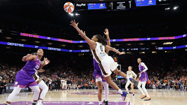 PHOENIX, ARIZONA - JULY 09: Kelsey Mitchell #0 of the Indiana Fever attempts a shot against Alyssa Thomas #25 of the Phoenix Mercury during the second half of the WNBA game at Mortgage Matchup Center on July 09, 2026 in Phoenix, Arizona. The Fever defeated the Mercury 92-89.