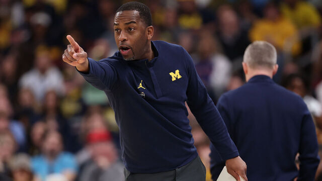 CHICAGO, ILLINOIS - MARCH 29: Assistant coach Mike Boynton Jr. of the Michigan Wolverines looks on against the Tennessee Volunteers in the Elite Eight of the 2026 NCAA Men's Basketball Tournament at the United Center on March 29, 2026 in Chicago, Illinois.