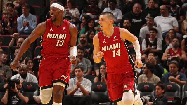 MIAMI, FL - NOVEMBER 26: Bam Adebayo #13 and Tyler Herro #14 of the Miami Heat looks on during the game against the Milwaukee Bucks during the 2025-26 Emirates Cup on November 26, 2025 at Kaseya Center in Miami, Florida. Mandatory Copyright Notice: Copyright 2025 NBAE