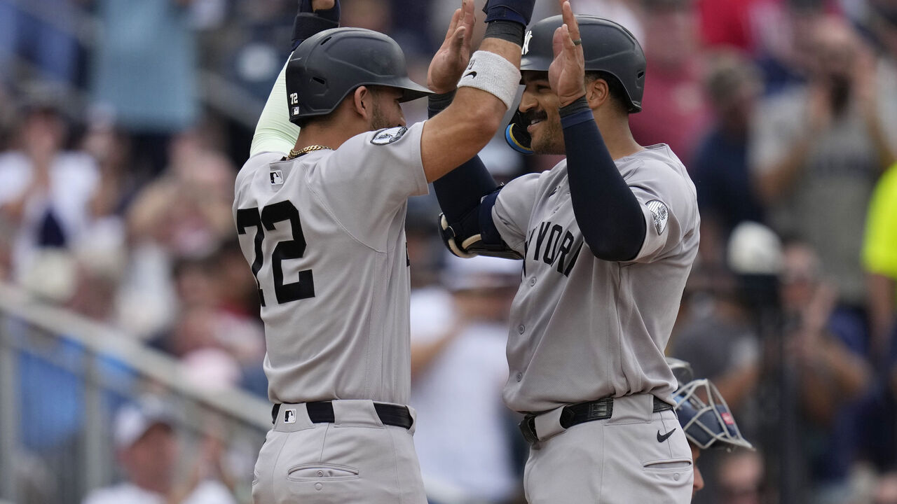 WASHINGTON, DC - JULY 11: Trent Grisham #12 celebrates with José Caballero #72 of the New York Yankees after he hits a go-ahead two run home run against the Washington Nationals during the eighth inning at Nationals Park on July 11, 2026 in Washington, DC.