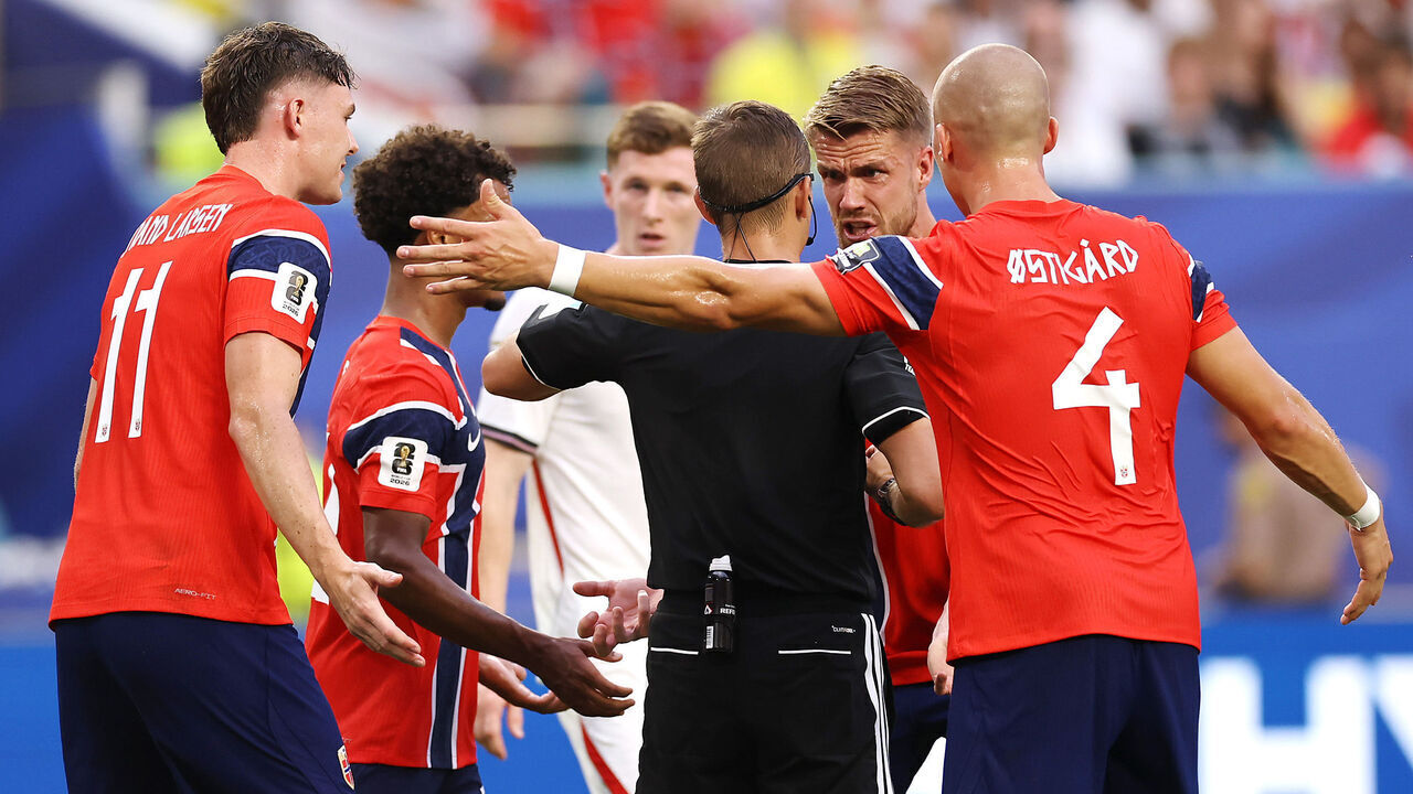 MIAMI GARDENS, FLORIDA - JULY 11: Referee Clement Turpin issues a yellow card to Kristoffer Ajer #3 of Norway during the FIFA World Cup 2026 Quarter Final match between Norway and England at Miami Stadium on July 11, 2026 in Miami Gardens, Florida.
