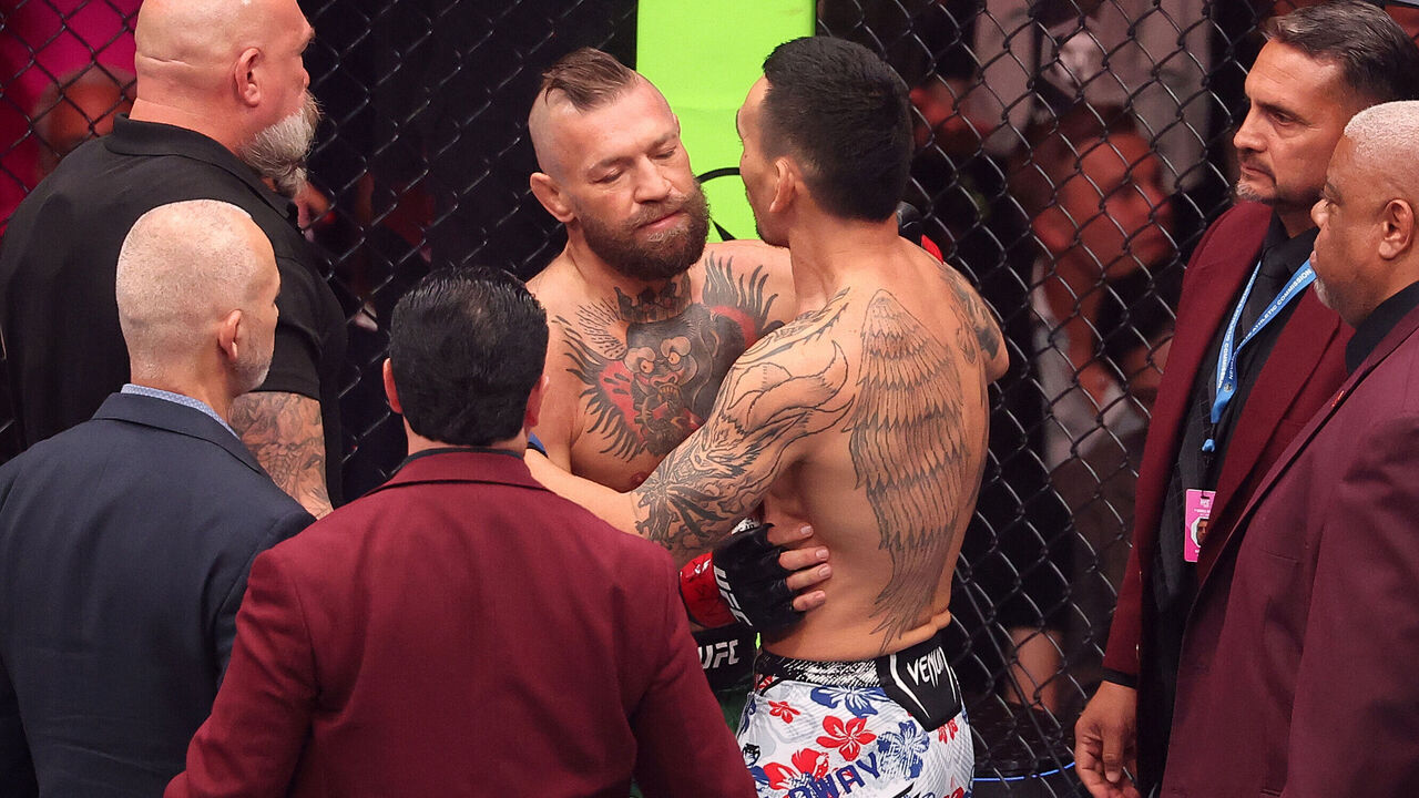 LAS VEGAS, NEVADA - JULY 11: (L-R) Conor McGregor of Ireland speaks with Max Holloway in a welterweight fight during the UFC 329 event at T-Mobile Arena on July 11, 2026 in Las Vegas, Nevada.