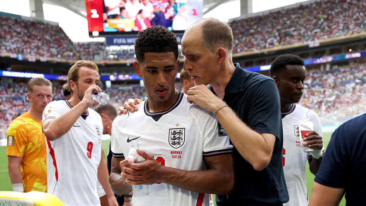MIAMI GARDENS, FLORIDA - JULY 11: Thomas Tuchel, Manager of England, speaks to Jude Bellingham #10 of England during a hydration break during the FIFA World Cup 2026 Quarter Final match between Norway and England at Miami Stadium on July 11, 2026 in Miami Gardens, Florida.