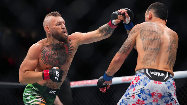 LAS VEGAS, NEVADA - JULY 11: (L-R) Conor McGregor of Ireland strikes Max Holloway in a welterweight fight during the UFC 329 event at T-Mobile Arena on July 11, 2026 in Las Vegas, Nevada.