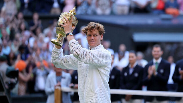 Italy's Jannik Sinner poses with the Gentleman's Singles trophy after his victory against Germany's Alexander Zverev at the end of their men's singles final tennis match on the last day of the 2026 Wimbledon Championships at The All England Lawn Tennis and Croquet Club in Wimbledon, southwest London, on July 12, 2026. / RESTRICTED TO EDITORIAL USE