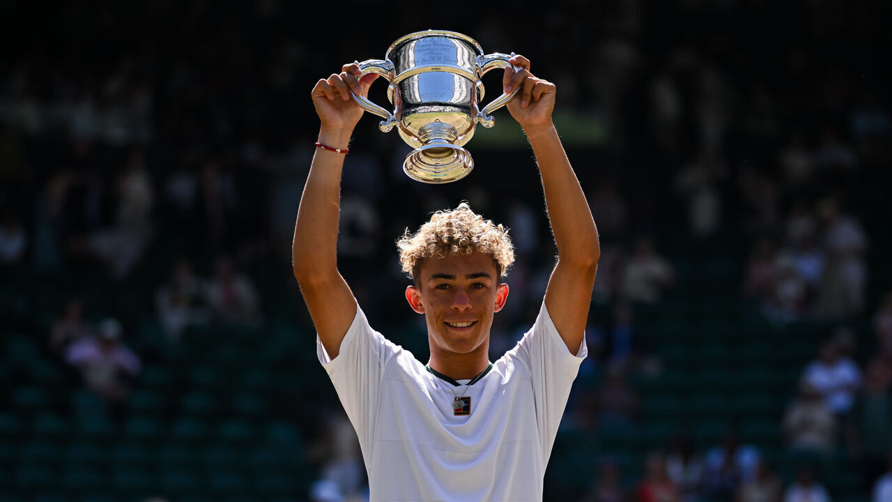 LONDON, ENGLAND - JULY 12: Jordan Lee of the United States poses with the trophy following his victory over Cruz Hewitt of Australia in the Boy's Singles Final on Day Fourteen of The Championships Wimbledon 2026 at All England Lawn Tennis and Croquet Club on July 12, 2026 in London, England.