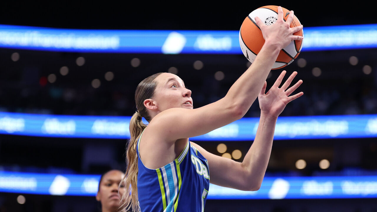 DALLAS, TEXAS - JULY 12: Paige Bueckers #5 of the Dallas Wings makes a move to the basket during the first quarter against the Chicago Sky at American Airlines Center on July 12, 2026 in Dallas, Texas.