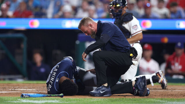 PHILADELPHIA, PENNSYLVANIA - JULY 14: Junior Caminero #13 of the Tampa Bay Rays seeks medical attention after being hit by a pitch during the third inning of the 2026 MLB All-Star Game at Citizens Bank Park on July 14, 2026 in Philadelphia, Pennsylvania.
