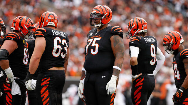 CINCINNATI, OH - DECEMBER 28: Cincinnati Bengals offensive tackle Orlando Brown Jr. (75) stands with his teammates during the game against the Arizona Cardinals and the Cincinnati Bengals on December 28, 2025, at Paycor Stadium in Cincinnati, OH.