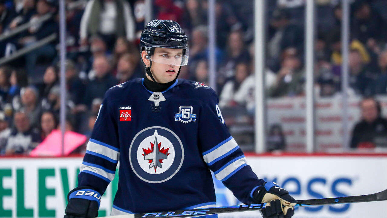 WINNIPEG, CANADA - MARCH 26: Cole Perfetti #91 of the Winnipeg Jets looks on during a third period stoppage in play against the Colorado Avalanche at the Canada Life Centre on March 26, 2026 in Winnipeg, Manitoba, Canada. The Avs defeated the Jets 3-2.