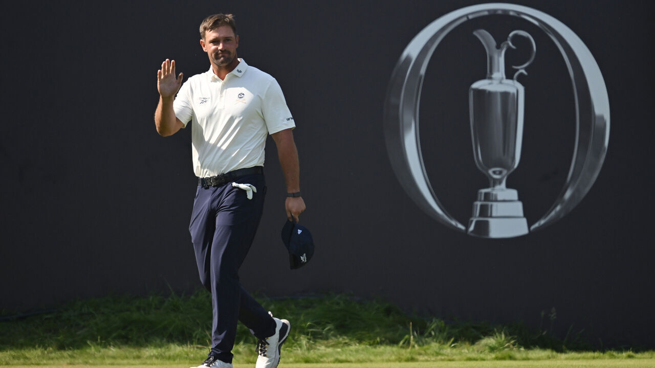 SOUTHPORT, ENGLAND - JULY 16: Bryson DeChambeau of the United States acknowledges the crowd as he prepares to tee off on the first hole during Day One of the The 154th Open Championship at Royal Birkdale on July 16, 2026 in Southport, England.