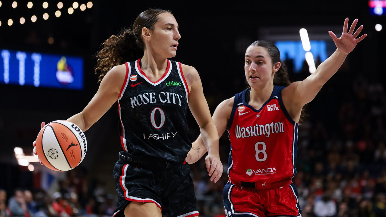 WASHINGTON, DC - JULY 16: Carla Leite #0 of the Portland Fire brings the ball up court against Georgia Amoore #8 of the Washington Mystics during the second half of the game at CareFirst Arena on July 16, 2026 in Washington, DC.